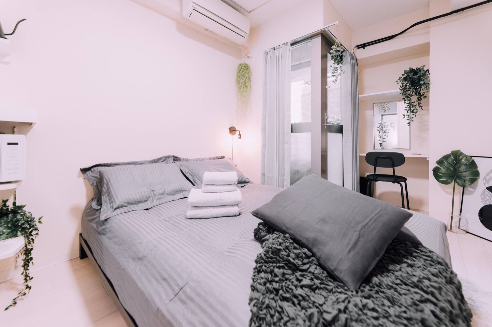 Minimalist Loft — Studio filled with light — bed by the window