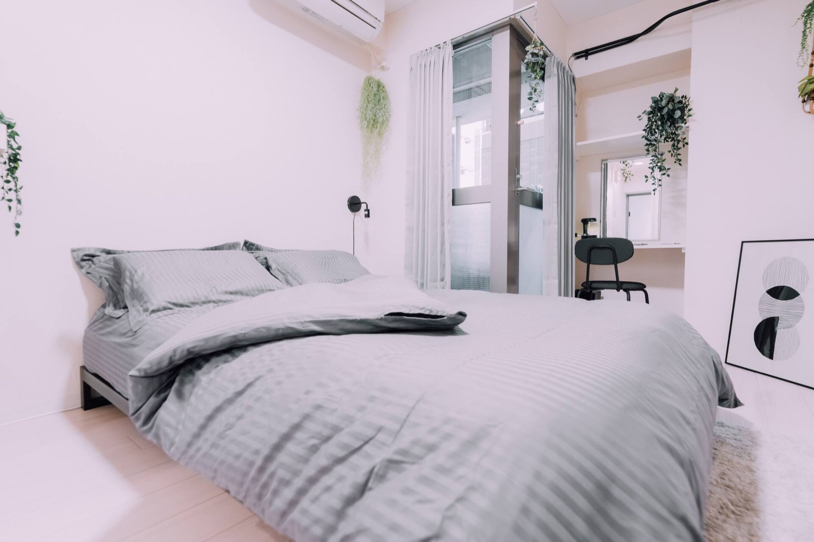 Minimalist Loft — Bedroom with memory-foam bed and soft colours