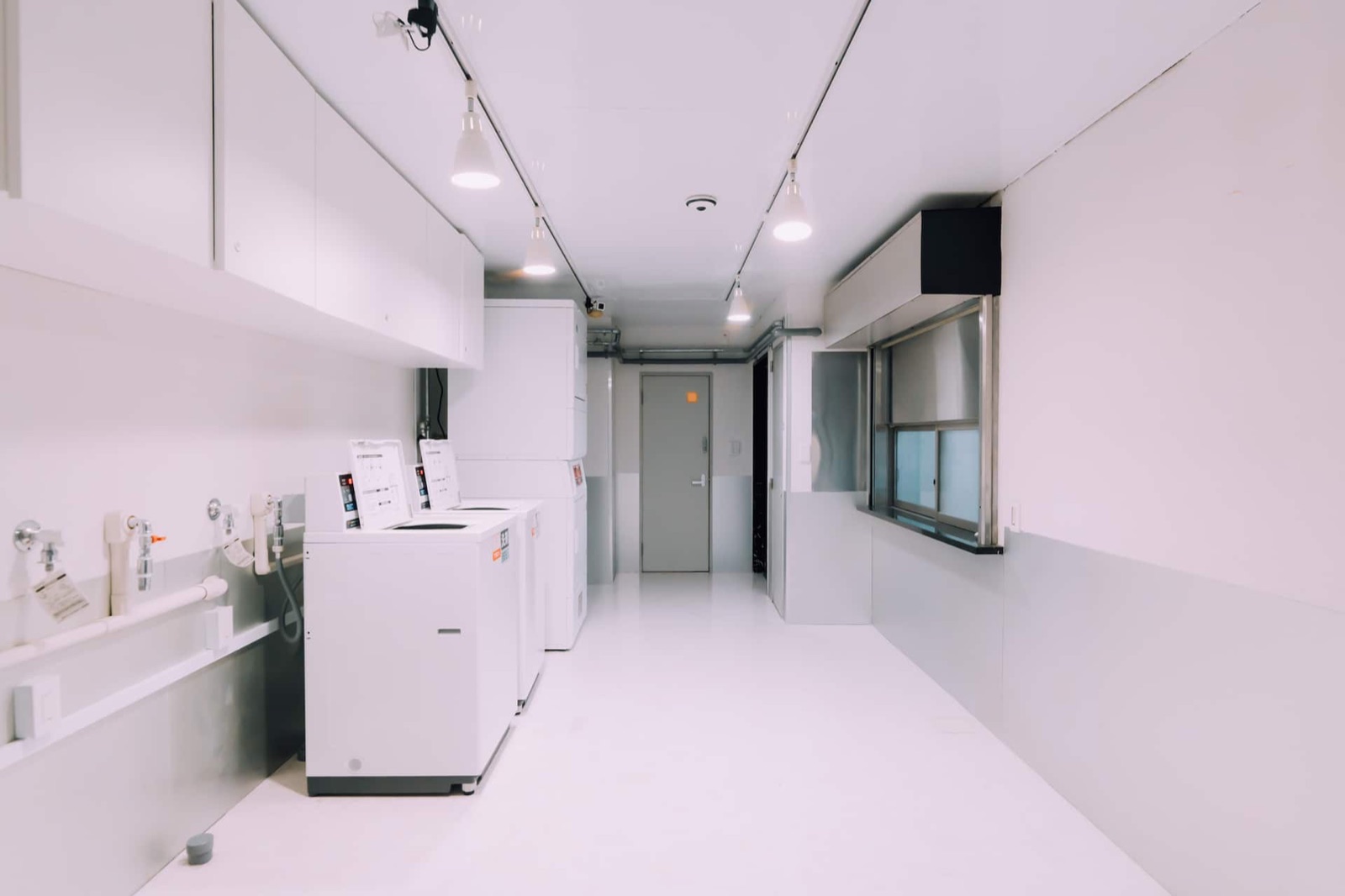 Minimalist Loft — Coin laundry on the ground floor