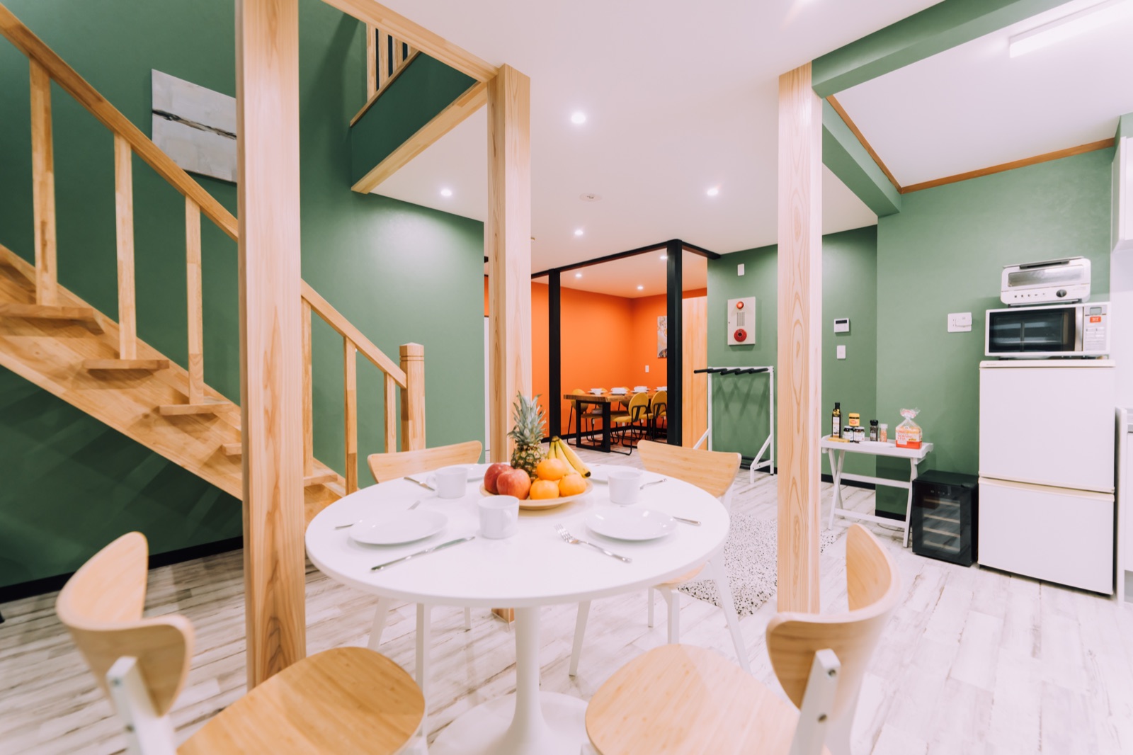 Yuzawa Onsen Lodge — House A dining and living area with the open staircase