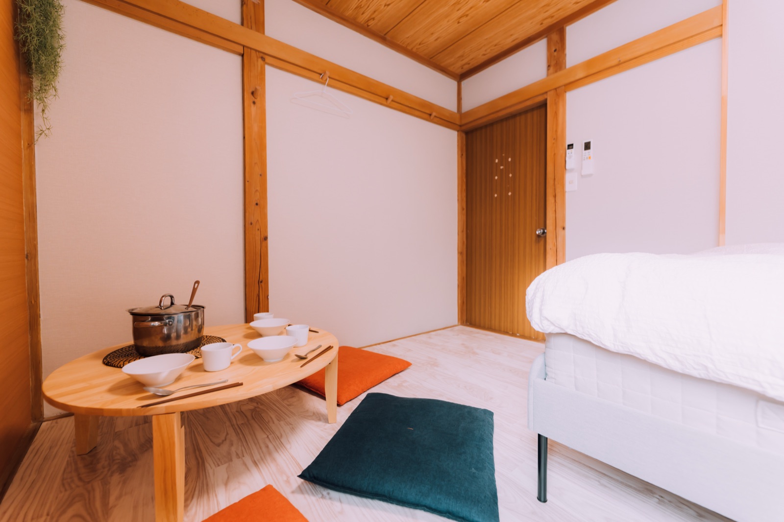 Yuzawa Onsen Lodge — Bedroom with a bed and a low table